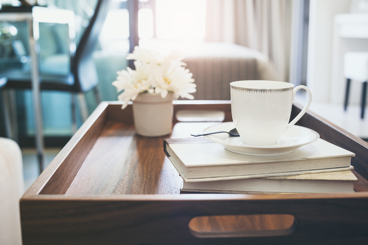 coffee cup over wooden tray